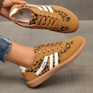 Detailed side view of women's leopard print sneakers with classic three-stripe design