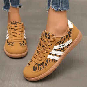 Detailed view of leopard print women's GAT sneakers featuring white side stripes