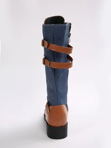 Detailed back view of women's denim and leather patchwork tall boots with buckle straps