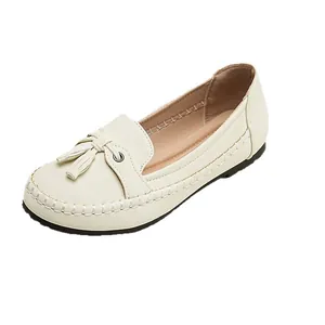 Women's cream flat loafers with decorative tassels and visible contrast stitching design