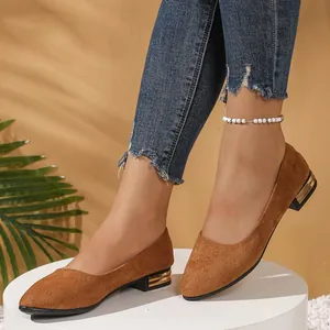 Elegant brown suede pointed toe flat shoes featuring decorative gold accented square heels