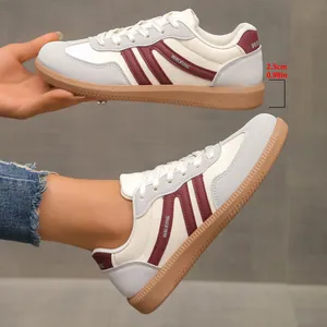 Detailed view of retro color-block German training shoes showing 2.5cm heel height.