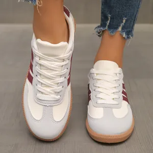 Stylish women's retro German Army Trainer sneakers in white and maroon color-block design