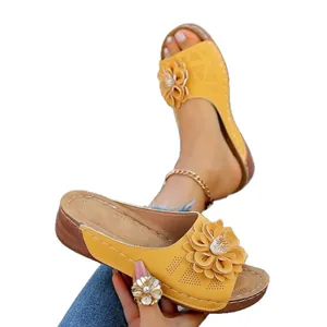 Stylish yellow wedge sandals for women with 3D flower decor and laser-cut detail