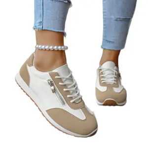 Stylish white and beige women's German trainer sneakers with zipper detail