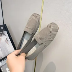 Close-up of khaki fly-knit women's flats with breathable square-toe texture