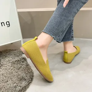 Comfortable yellow fly-knit flat shoes for women with soft sole and stylish square toe