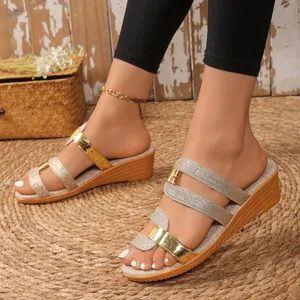 Women's stylish gold and silver glitter wedge sandals for summer comfort and outdoor wear.