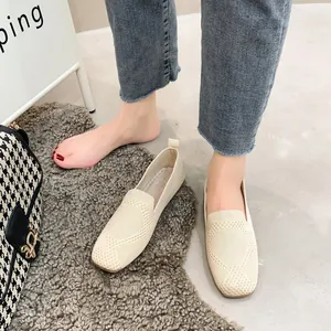 Detailed view of beige knitted square toe flat loafers with breathable mesh texture
