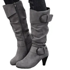 Elegant grey suede high heel mid-calf boots featuring decorative buckle and zipper