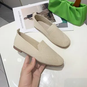 Comfortable women's beige fly-knit square toe flats with a soft sole and breathable fabric