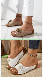 Elegant wedge sandals featuring laser-cut floral details and a 4.6cm platform heel for summer
