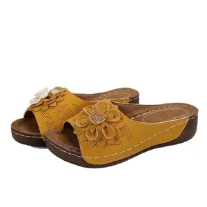 Stylish yellow wedge sandals for women featuring floral decor and breathable hollow cutouts