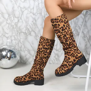 Macro view showing the leopard print texture and slouchy design of these suede chunky boots