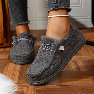 Close-up detail of grey plush winter loafers for women featuring thick non-slip soles