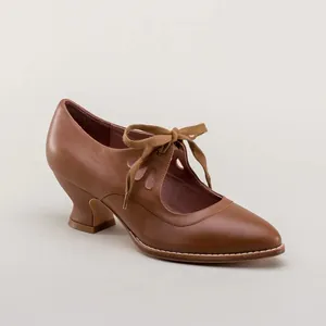 Vintage brown pointed toe high heels with cutout details and ribbon lace-up bow.