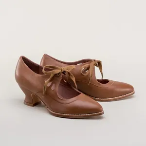 Detail view of vintage brown leather lace-up high heels with elegant hollow-out cutout design