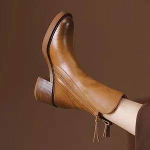 Vintage brown leather mid-calf boots with chunky heel and side zipper closure for women