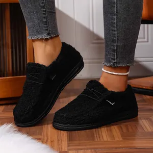 Macro view showing the soft fuzzy texture of black warm winter fleece-lined platform shoes