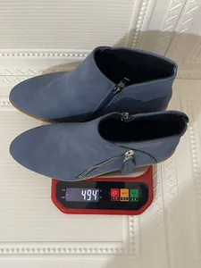 Blue suede ankle boots with double side zippers showing a weight of 494 grams