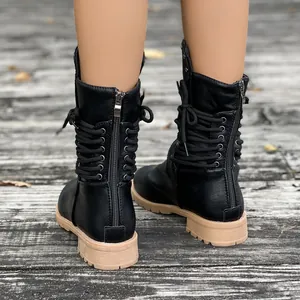 Rear view of black mid-calf knight boots featuring back zipper and lace detail