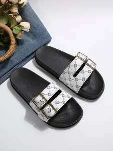 Dames slippers met dubbele gesp, witte geometrische bloemenprint en zwarte zool