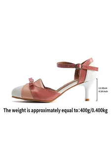 Detailed side view of stylish pink and white color-block heeled sandals with ankle strap.