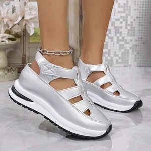 Silver hollow-out platform sandals for women featuring wedge heels and velcro straps.