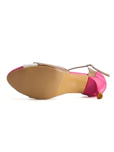 Detailed view of colorblock sandal sole featuring non-slip texture and a slim heel.