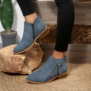 Chic blue pointed toe ankle boots with a chunky low heel and double side zippers