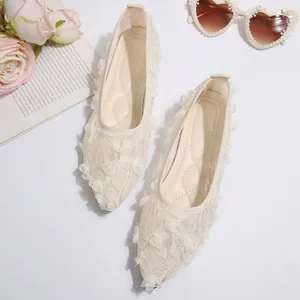 Close-up of elegant 3D lace floral patterns on breathable cream mesh flat shoes
