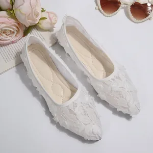 Elegant white lace pointed-toe flat shoes for women with delicate floral embroidery