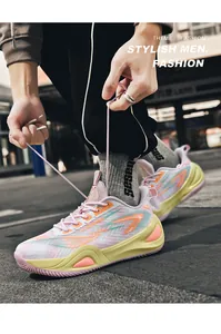 Close-up of stylish men tying laces on colorful breathable mesh basketball shoes