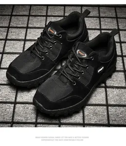 Black men's outdoor hiking shoes featuring durable non-slip soles for mountain trekking