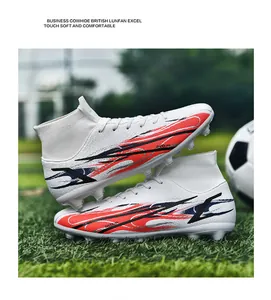 White high-top soccer cleats with flyknit collar and dynamic red flame design for training