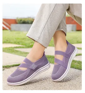 Breathable purple mesh slip-on walking shoes for women shown in an outdoor park setting