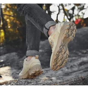 Action shot of durable men's khaki hiking shoes showing the rugged anti-slip sole