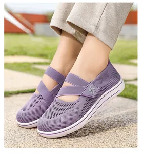 Detail shot of purple breathable knit loafers for women featuring elastic cross straps