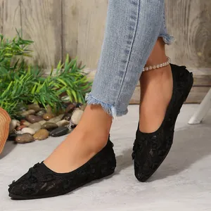 Elegant black lace pointed-toe flat shoes featuring intricate floral design texture