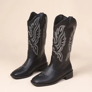 Stylish vintage black western cowboy boots with white embroidery and chunky heels