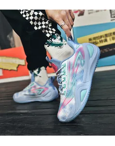 Close-up of stylish blue mesh basketball sneaker with vibrant pink and mint accents