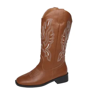 Detailed side profile of brown Western cowboy boots featuring intricate white embroidery
