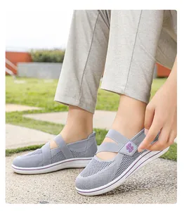 Close-up of breathable gray mesh walking shoes for women with cross strap