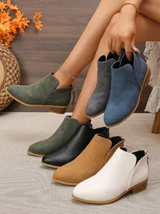Assorted women's pointed toe ankle boots featuring back zippers and low chunky heels.