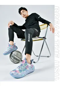 Detailed shot of blue breathable mesh basketball shoes worn by a male model in studio