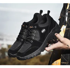 Detailed view of black low-top men's hiking shoes featuring a durable and non-slip rubber sole