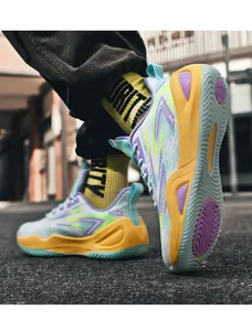 Detailed view of breathable basketball shoes with vibrant orange and blue colorway