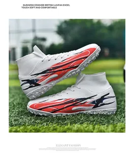 Side view of white high-top soccer cleats featuring vibrant red and black flame designs