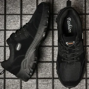 Black men's low-top hiking shoes with durable rubber soles for outdoor trekking and sports.