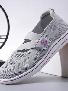Grey flyknit mesh walking shoes for women featuring breathable hollow design and purple accents
